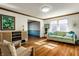 Cozy living room featuring hardwood floors, a comfortable couch, and natural light at 3634 W 58Th St, Indianapolis, IN 46228
