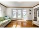 Bright living room with a bay window, hardwood floors, and a comfortable sofa at 3634 W 58Th St, Indianapolis, IN 46228