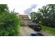 A home with a deck in the backyard and an adjacent parking area at 3818 Graceland Ave, Indianapolis, IN 46208