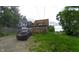 A quaint home with a rear deck and parking nestled by the roadside at 3818 Graceland Ave, Indianapolis, IN 46208