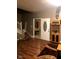 Open living space with hardwood floors and transition to dining area at 3818 Graceland Ave, Indianapolis, IN 46208