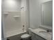 Bright bathroom features a tub-shower, modern vanity with quartz countertop and a mirror at 3915 Donaldson Creek Ct, Clayton, IN 46118