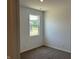 Cozy bedroom with carpet, a window offering natural light, and neutral walls at 3915 Donaldson Creek Ct, Clayton, IN 46118