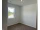 Cozy bedroom with carpet, a window offering natural light, and neutral walls at 3915 Donaldson Creek Ct, Clayton, IN 46118