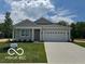 Charming single-story home with manicured lawn and attached two-car garage on a sunny day at 3915 Donaldson Creek Ct, Clayton, IN 46118