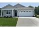 Charming single-story home featuring a manicured lawn, a two-car garage and neutral toned siding at 3915 Donaldson Creek Ct, Clayton, IN 46118