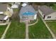 Aerial view of the home with well-maintained lawn, trees and its proximity to neighborhood amenities at 3924 E 30Th St, Indianapolis, IN 46218