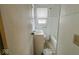 Bathroom featuring a tub, vanity, and a window, offering a simple and functional space at 3924 E 30Th St, Indianapolis, IN 46218