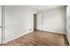 Bright bedroom with laminate flooring featuring an open doorway at 3924 E 30Th St, Indianapolis, IN 46218