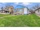 Inviting single-story home featuring a lush lawn and blue accents, creating a cozy curb appeal at 3924 E 30Th St, Indianapolis, IN 46218