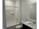 Bathroom featuring a shower-tub combo and a single sink vanity with a modern faucet at 3933 Donaldson Creek Ct, Clayton, IN 46118