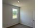 Well-lit bedroom with carpeted floors and a window offering a view of the outdoors at 3933 Donaldson Creek Ct, Clayton, IN 46118