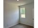 Well-lit bedroom with carpeted floors and a window offering a view of the outdoors at 3933 Donaldson Creek Ct, Clayton, IN 46118