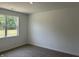 Well-lit bedroom with carpeted floors and a window offering a view of the outdoors at 3933 Donaldson Creek Ct, Clayton, IN 46118