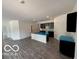 Open concept kitchen with center island and black appliances adds great space for cooking and entertaining at 3933 Donaldson Creek Ct, Clayton, IN 46118