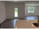 Bright, open kitchen with white countertops, stainless steel sink, and a view to the living room at 3933 Donaldson Creek Ct, Clayton, IN 46118