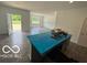 Spacious living area provides natural light, access to the backyard, and neutral paint color ready for customization at 3933 Donaldson Creek Ct, Clayton, IN 46118