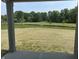 Backyard view from the patio overlooking a lush green landscape at 3949 Donaldson Creek Ct, Clayton, IN 46118
