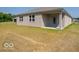 A spacious backyard featuring a patio area and expansive lawn, perfect for outdoor activities and relaxation at 3949 Donaldson Creek Ct, Clayton, IN 46118