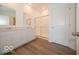 Bathroom with double vanity, a glass-enclosed shower, and vinyl flooring at 3949 Donaldson Creek Ct, Clayton, IN 46118