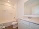 Clean bathroom featuring a modern vanity, full tub and shower, and neutral color scheme at 3949 Donaldson Creek Ct, Clayton, IN 46118