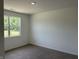 An empty bedroom with neutral walls and carpet at 3949 Donaldson Creek Ct, Clayton, IN 46118