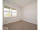 Bright, carpeted bedroom with a large window offering plenty of natural light at 3949 Donaldson Creek Ct, Clayton, IN 46118