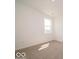 Bright, empty bedroom with neutral carpet and a window at 3949 Donaldson Creek Ct, Clayton, IN 46118