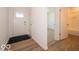 Bright entryway with hardwood floors and a view of a bathroom and carpeted room at 3949 Donaldson Creek Ct, Clayton, IN 46118