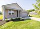 Charming single-story home with lush green lawn and stylish gray accents on the porch at 3949 Donaldson Creek Ct, Clayton, IN 46118