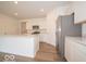 Bright kitchen with stainless steel appliances, white cabinetry, and a kitchen island at 3949 Donaldson Creek Ct, Clayton, IN 46118