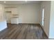 Bright living room featuring hardwood floors, white walls, recessed lighting, and a glass door at 3949 Donaldson Creek Ct, Clayton, IN 46118
