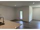 Bright living room featuring hardwood floors, white walls, recessed lighting, and a countertop at 3949 Donaldson Creek Ct, Clayton, IN 46118
