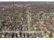 Scenic aerial view of a neighborhood with tree-lined streets on a sunny day at 3970 Broadway St, Indianapolis, IN 46205