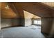 Finished attic space with wood ceiling and dormer window at 3970 Broadway St, Indianapolis, IN 46205