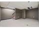 Unfinished basement featuring concrete floor and stairs at 3970 Broadway St, Indianapolis, IN 46205