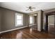 This bedroom features a window, ceiling fan and mirrored closet at 3970 Broadway St, Indianapolis, IN 46205