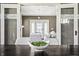 Dining area with bowl of greenery centerpiece flowing into a cozy living room at 3970 Broadway St, Indianapolis, IN 46205