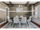 Dining room with wood beams, neutral walls, and a dining table with modern chairs at 3970 Broadway St, Indianapolis, IN 46205