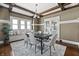 Dining area with a wooden dining table, six chairs, and bench seating by the window at 3970 Broadway St, Indianapolis, IN 46205