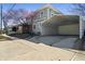 View of the side of the two-story house, including a covered carport at 3970 Broadway St, Indianapolis, IN 46205