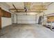 Spacious garage with a white door, open ceiling, and mounted storage cabinets for ample storage at 3970 Broadway St, Indianapolis, IN 46205