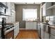 Charming kitchen featuring white cabinets, butcher block countertops, and stainless steel appliances at 3970 Broadway St, Indianapolis, IN 46205