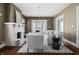 Well-appointed living room featuring hardwood floors, stylish decor, and a white brick fireplace, creating a cozy ambiance at 3970 Broadway St, Indianapolis, IN 46205