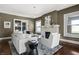 Bright living room with hardwood floors, painted brick fireplace, and stylish furniture for a comfortable setting at 3970 Broadway St, Indianapolis, IN 46205