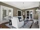 Elegant living room featuring modern decor, hardwood floors, and large windows for natural light at 3970 Broadway St, Indianapolis, IN 46205