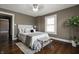 Bedroom with natural light, hardwood floors, and stylish furniture at 3970 Broadway St, Indianapolis, IN 46205