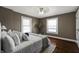 Bedroom with natural light, hardwood floors, and a comfortable, well-appointed bed at 3970 Broadway St, Indianapolis, IN 46205