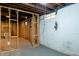 Unfinished basement with stud framing, exposed utilities, and installed walls at 4547 Farrington Ave, Indianapolis, IN 46201