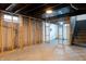 Unfinished basement featuring stud framing and exposed ceiling at 4547 Farrington Ave, Indianapolis, IN 46201